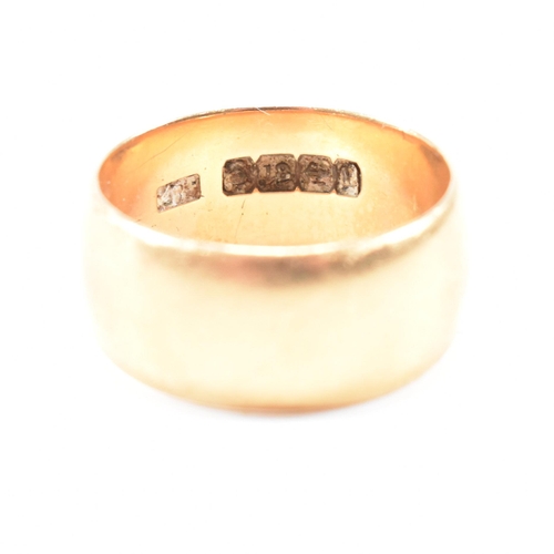 97 - A hallmarked 18ct gold band ring. The ring hallmarked Birmingham. Weight 9.8g. Size Q. All weights, ... 