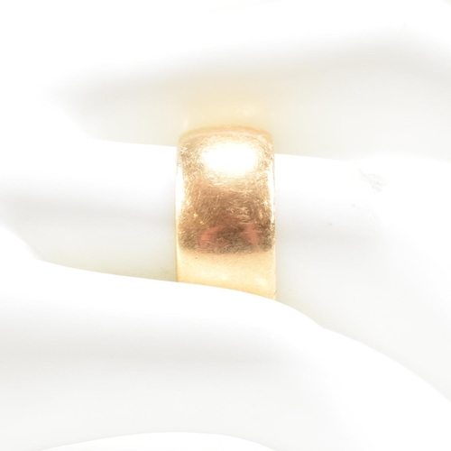 97 - A hallmarked 18ct gold band ring. The ring hallmarked Birmingham. Weight 9.8g. Size Q. All weights, ... 