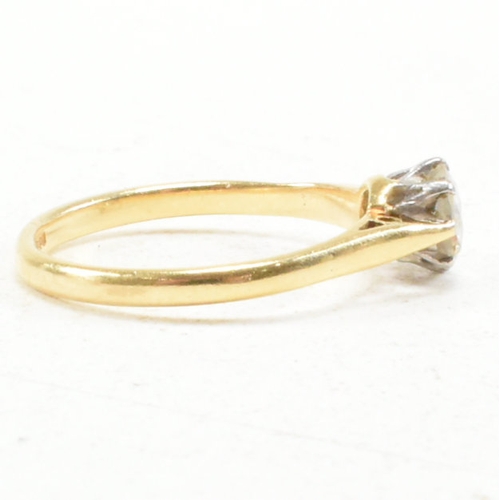 31 - A hallmarked 18ct gold and diamond solitaire ring. The ring set with a round brilliant cut diamond t... 