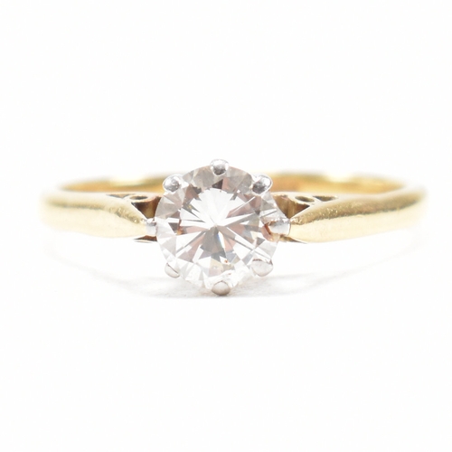 31 - A hallmarked 18ct gold and diamond solitaire ring. The ring set with a round brilliant cut diamond t... 