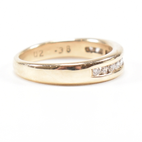 205 - A hallmarked 9ct gold and diamond half eternity ring. The ring set with twelve suspension set round ... 