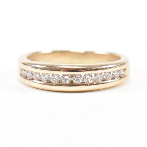 205 - A hallmarked 9ct gold and diamond half eternity ring. The ring set with twelve suspension set round ... 