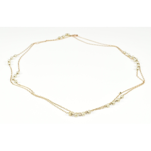 210 - An antique 9ct yellow gold & pearl bead chain necklace. The chain comprised of fine cable links with... 