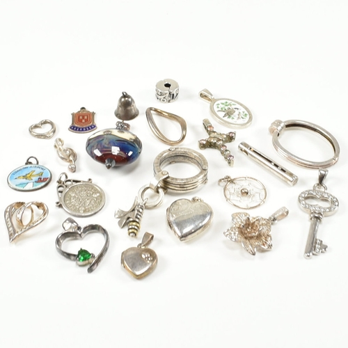 240 - An assorted collection of silver necklace pendants & charms. The lot to include a tubular pendant se... 