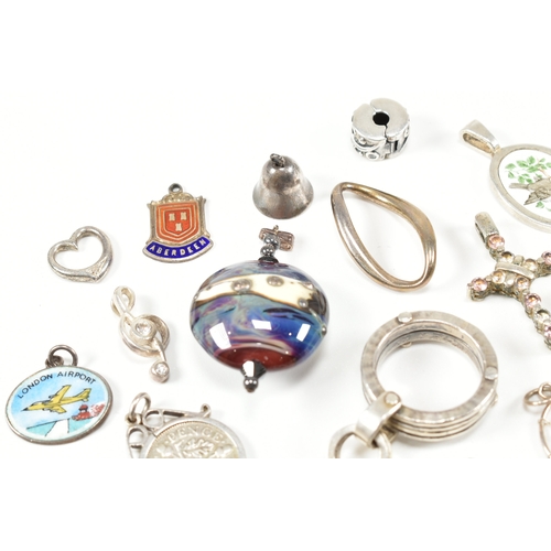 240 - An assorted collection of silver necklace pendants & charms. The lot to include a tubular pendant se... 