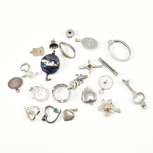 240 - An assorted collection of silver necklace pendants & charms. The lot to include a tubular pendant se... 