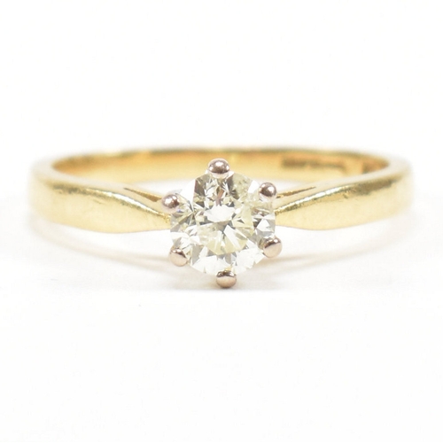 300 - A hallmarked 18ct gold and diamond solitaire ring. The ring set with a single claw mounted diamond t... 