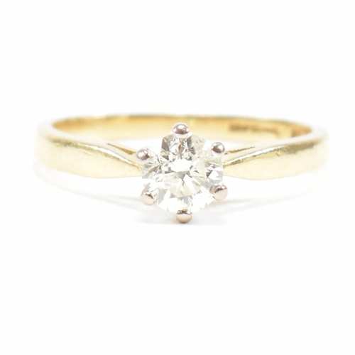 300 - A hallmarked 18ct gold and diamond solitaire ring. The ring set with a single claw mounted diamond t... 