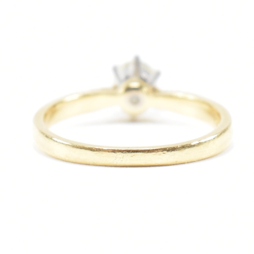 300 - A hallmarked 18ct gold and diamond solitaire ring. The ring set with a single claw mounted diamond t... 