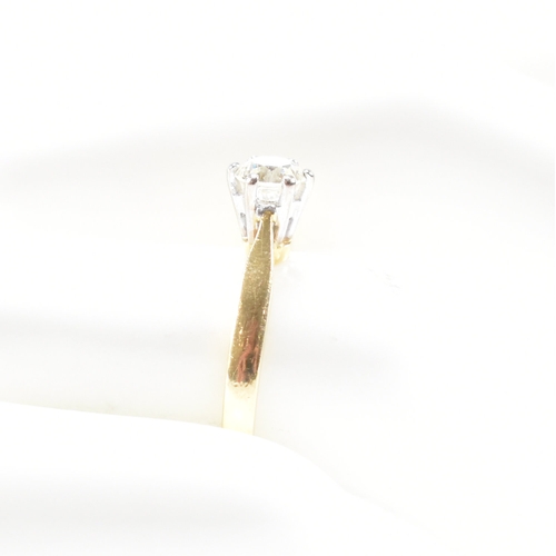 300 - A hallmarked 18ct gold and diamond solitaire ring. The ring set with a single claw mounted diamond t... 