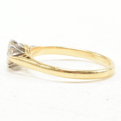 31 - A hallmarked 18ct gold and diamond solitaire ring. The ring set with a round brilliant cut diamond t... 