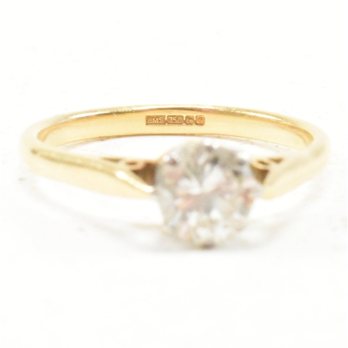 31 - A hallmarked 18ct gold and diamond solitaire ring. The ring set with a round brilliant cut diamond t... 