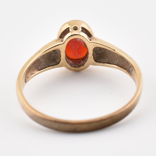 359 - A hallmarked 9ct yellow gold & red stone solitaire ring. The single stone ring having an oval cut be... 