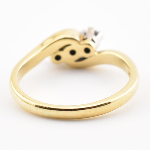 368 - A hallmarked 18ct yellow gold & diamond crossover ring. The ring having three round cut graduating d... 