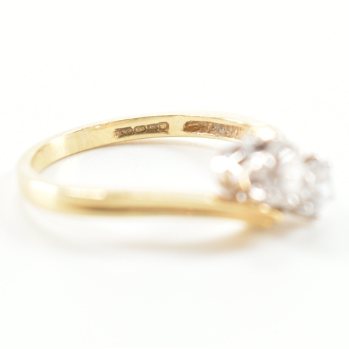 419 - Two 14ct gold and cz dress rings. The lot to include a two stone crossover ring hallmarked London, s... 