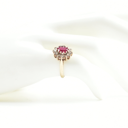 424 - Two hallmarked 9ct gold stone set rings. The lot to include a synthetic ruby ring surrounded by whit... 