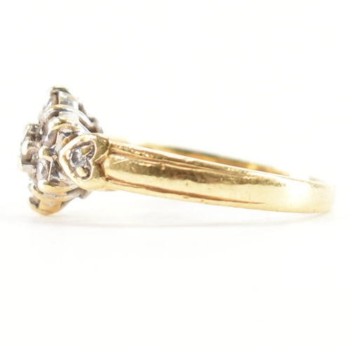 440 - A hallmarked 18ct gold and diamond cluster ring. The ring being set with a cluster of round cut diam... 