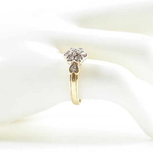 440 - A hallmarked 18ct gold and diamond cluster ring. The ring being set with a cluster of round cut diam... 