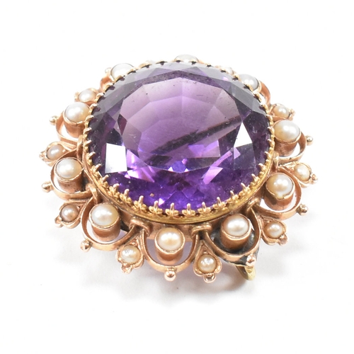 471 - An early 20th century amethyst and pearl brooch pin.  The brooch set with a central mixed cut amethy... 