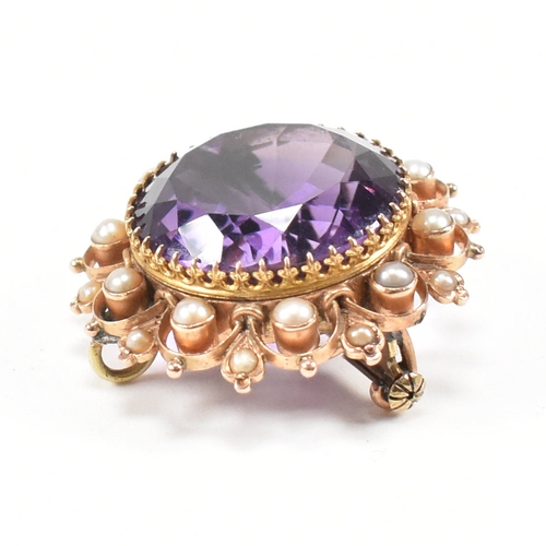 471 - An early 20th century amethyst and pearl brooch pin.  The brooch set with a central mixed cut amethy... 