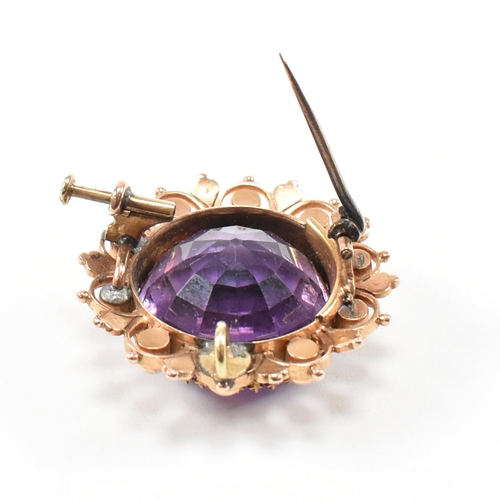 471 - An early 20th century amethyst and pearl brooch pin.  The brooch set with a central mixed cut amethy... 