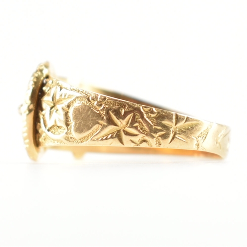 488 - A hallmarked 18ct yellow gold buckle ring. The ring in the form of a fastened belt having etched fol... 