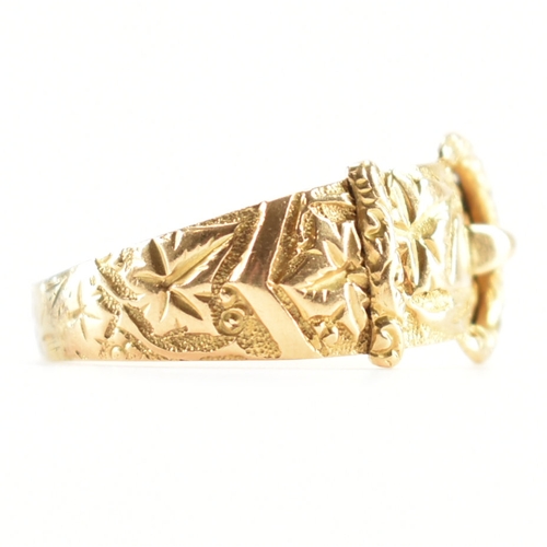 488 - A hallmarked 18ct yellow gold buckle ring. The ring in the form of a fastened belt having etched fol... 