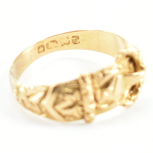 488 - A hallmarked 18ct yellow gold buckle ring. The ring in the form of a fastened belt having etched fol... 