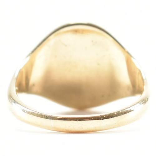 492 - A hallmarked 9ct yellow gold signet ring. The ring having a circular head to tapering band. Hallmark... 