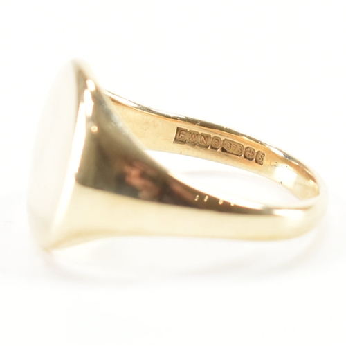 492 - A hallmarked 9ct yellow gold signet ring. The ring having a circular head to tapering band. Hallmark... 