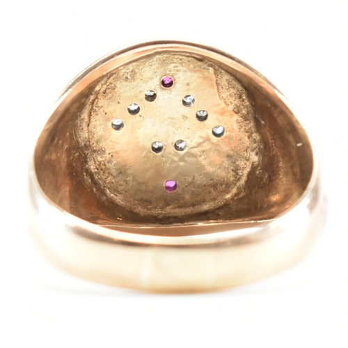 494 - An 18ct yellow gold, diamond & ruby set Masonic signet ring. The ring having an oval head with diamo... 