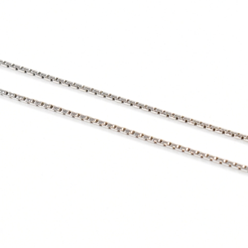 496 - A hallmarked 18ct white gold and diamond pendant necklace.  The necklace strung with a square pendan... 