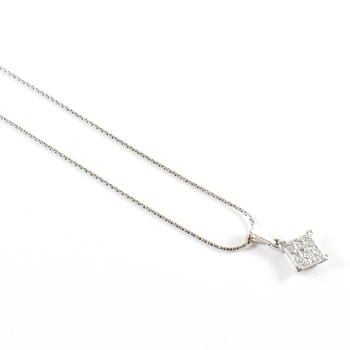 496 - A hallmarked 18ct white gold and diamond pendant necklace.  The necklace strung with a square pendan... 