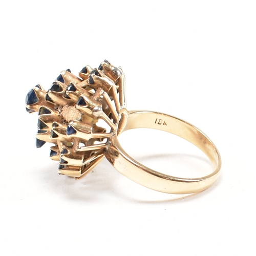 17a - A 1970s 18ct yellow gold and sapphire bombe cocktail ring. The ring having a round cut sapphire to t... 