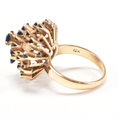 17a - A 1970s 18ct yellow gold and sapphire bombe cocktail ring. The ring having a round cut sapphire to t... 