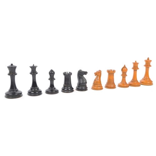 270 - A set of 20th century carved wooden chess pieces being weighted with baize to base. Measures 80mm ta... 