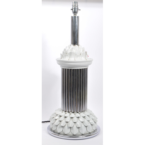 550 - A 20th century clear lucite Art Deco style desk table lamp light. The lamp having a chrome ribbed ce... 