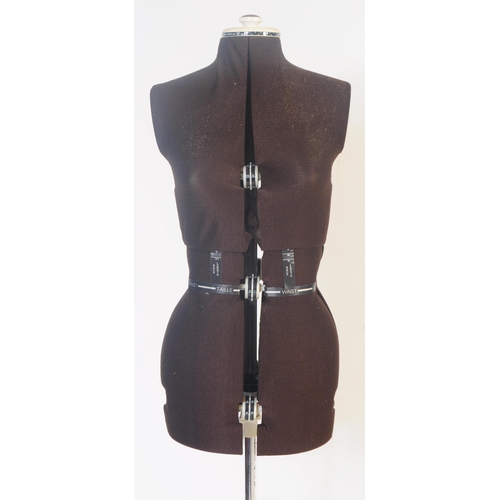 551 - A vintage mid 20th century circa 1960s-70s tailor's or dressmaker's adjustable mannequin with brown ... 