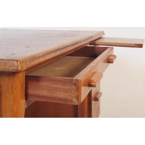 552 - A vintage mid 20th century oak ministry of defence office desk table. Of rectangular form with knee ... 