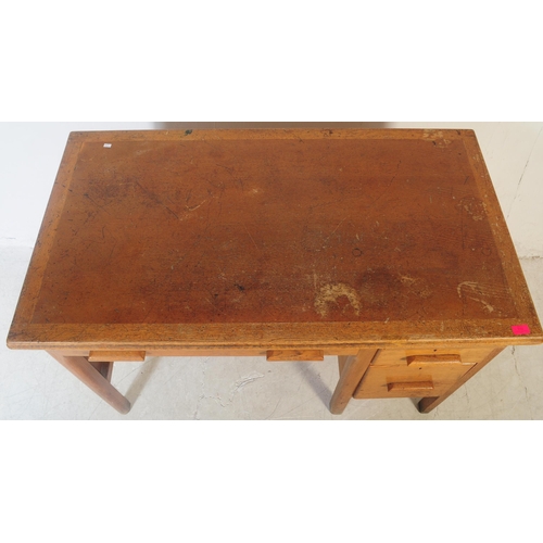 552 - A vintage mid 20th century oak ministry of defence office desk table. Of rectangular form with knee ... 