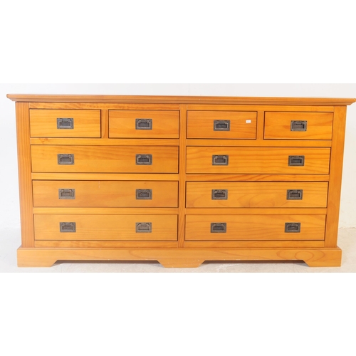 556 - A contemporary oak furniture land style double chest of drawers. Of rectangular form with flared top... 