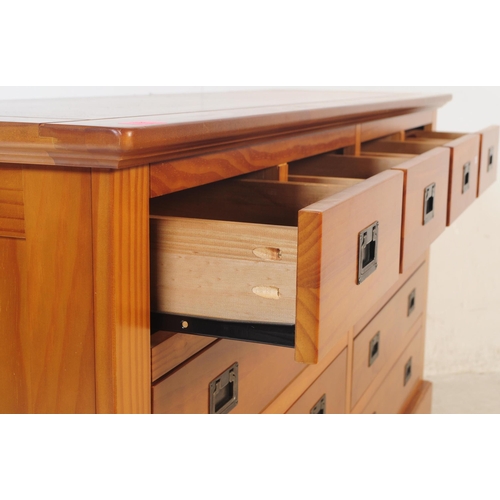 556 - A contemporary oak furniture land style double chest of drawers. Of rectangular form with flared top... 