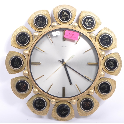 560 - Metamec - A vintage 20th century Metamec battery operated wall hanging clock. Having a silver face w... 