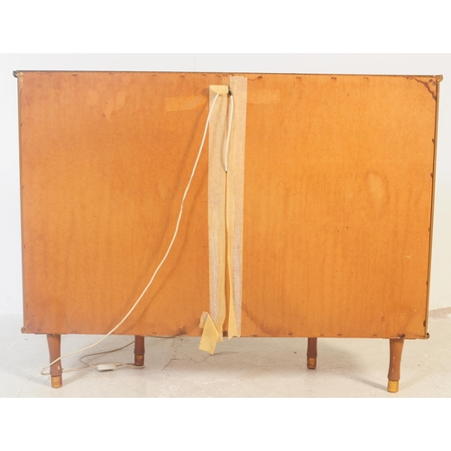 564 - A vintage mid 20th century circa 1960s glass mirror back display cabinet. The cabinet having mirror ... 