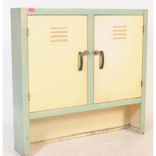 565 - A retro 20th century metal two tone kitchen storage locker cupboard. Having twin doors to front in c... 