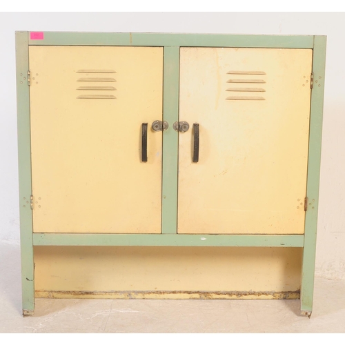565 - A retro 20th century metal two tone kitchen storage locker cupboard. Having twin doors to front in c... 