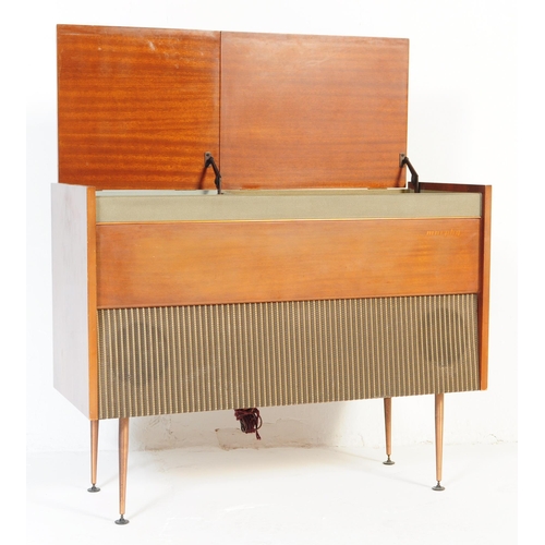 566 - Murphy - A retro mid 20th Century free standing stereogram / radio credenza having a teak and metal ... 