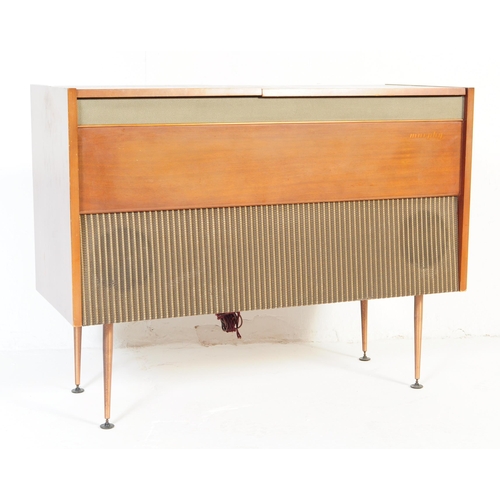 566 - Murphy - A retro mid 20th Century free standing stereogram / radio credenza having a teak and metal ... 