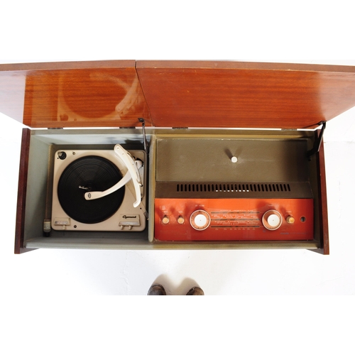 566 - Murphy - A retro mid 20th Century free standing stereogram / radio credenza having a teak and metal ... 
