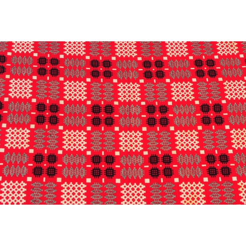 583 - A vintage 20th century Welsh blanket. Of rectangular form with geometric pattern squares, in red, wh... 